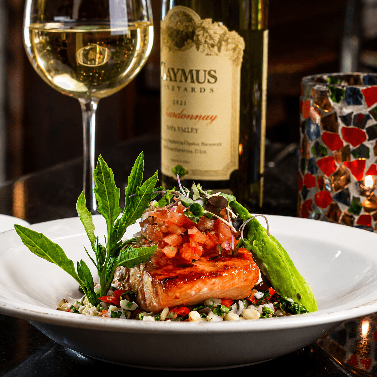 Grilled avocado salmon with pico de gallo and Caymus Chardonnay