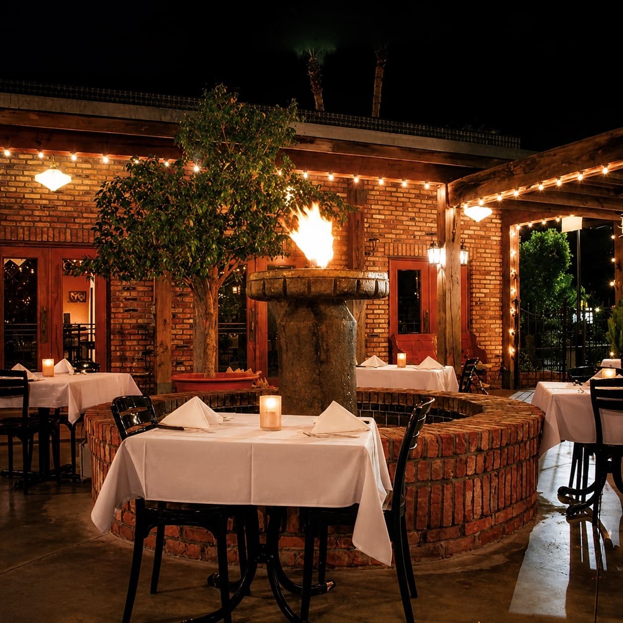 Republic of the Rio Grande patio at night, firepit glowing